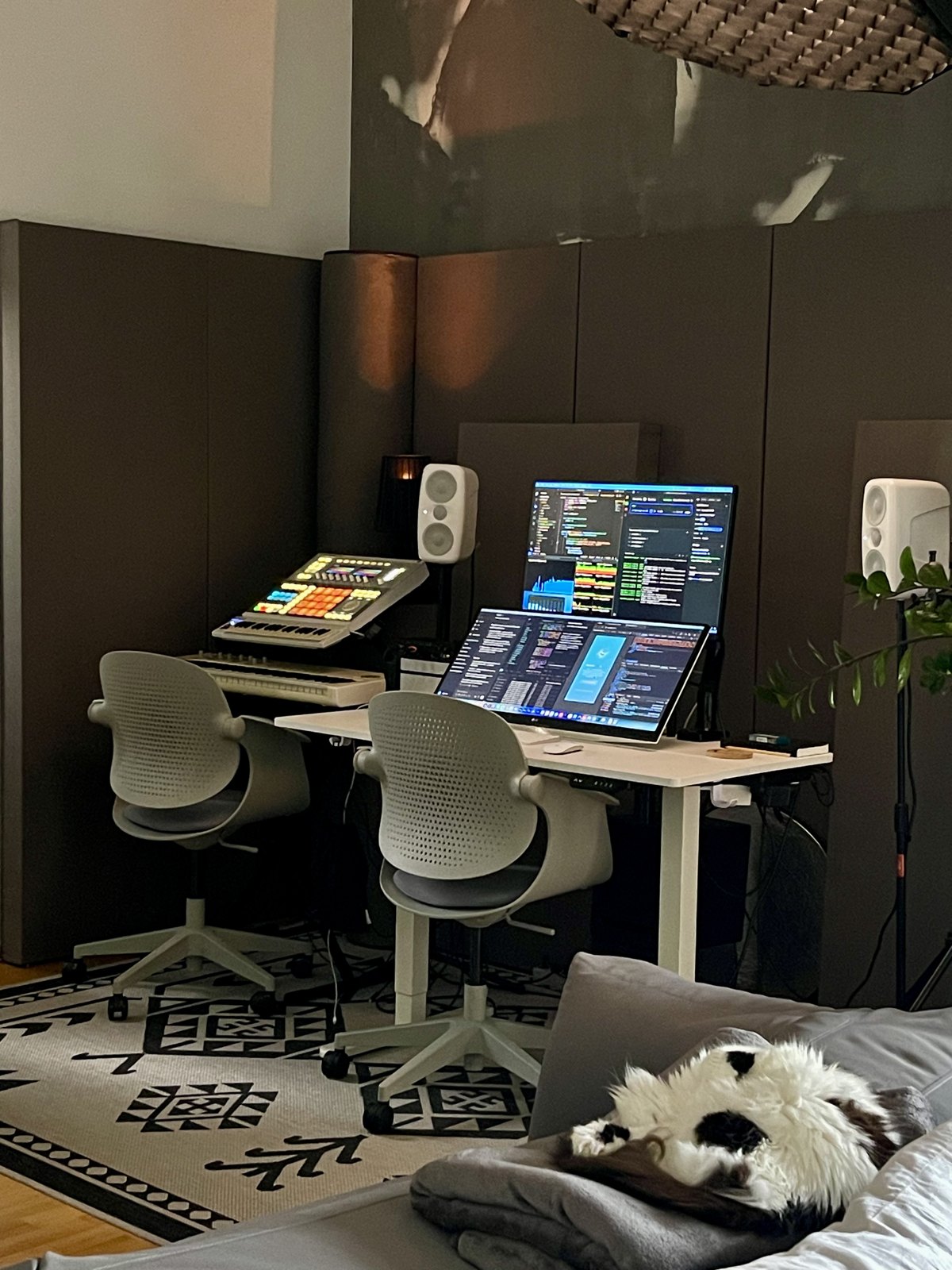 Empty studio desk with two monitors and two chairs