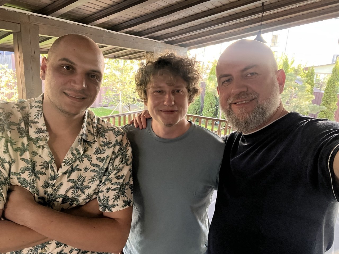Three members of the Psynex team outdoors in summer